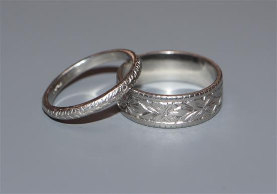 Two white metal wedding bands stamped Plat.